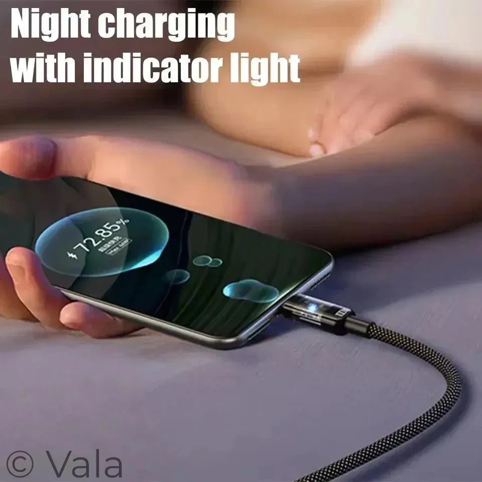 Smartphone being charged with a visible indicator light on a blurred background