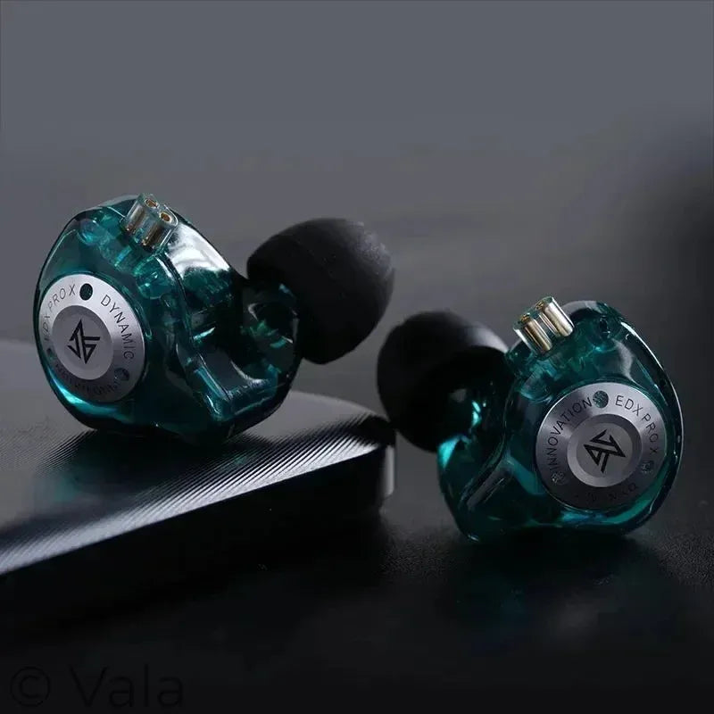 Pair of teal earbuds with visible brand logo on a dark background