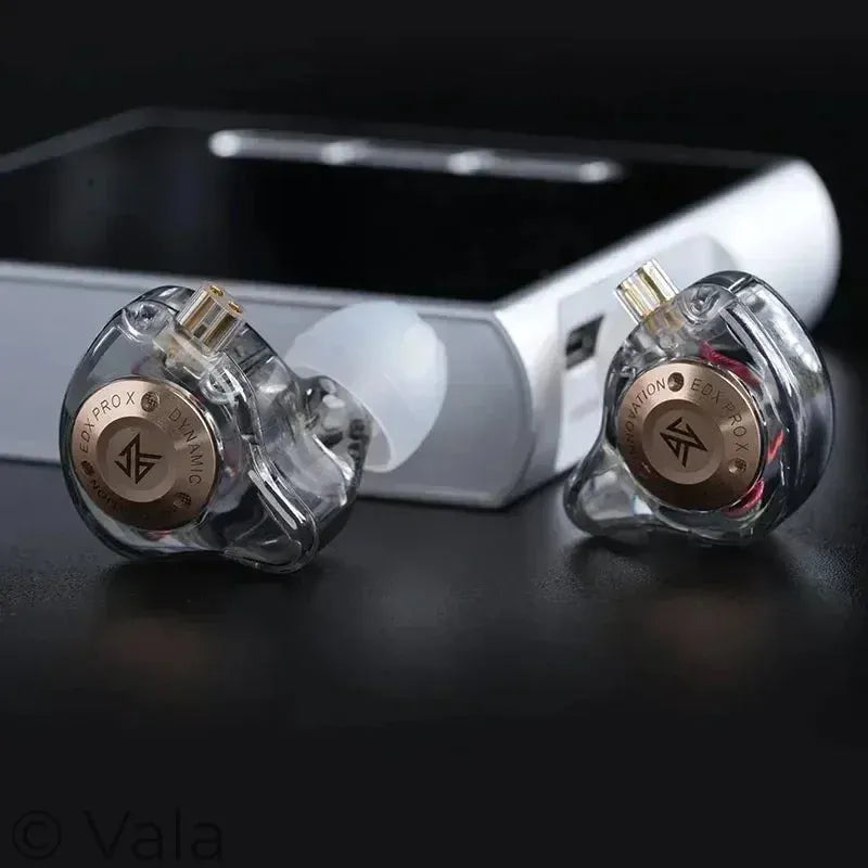 Pair of high-end earbuds with visible brand logo on a dark background